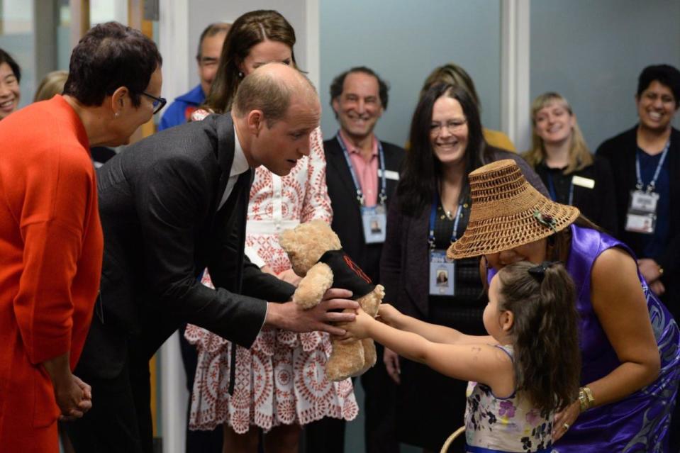 The Duke and Duchess of Cambridge receive teddy bears from five-year-old Hailey Cain during a tour of Sheway, a centre that provides support for native women, in Vancouver, B.C., Sunday, Sept. 25, 2016. THE CANADIAN PRESS/Jonathan Hayward