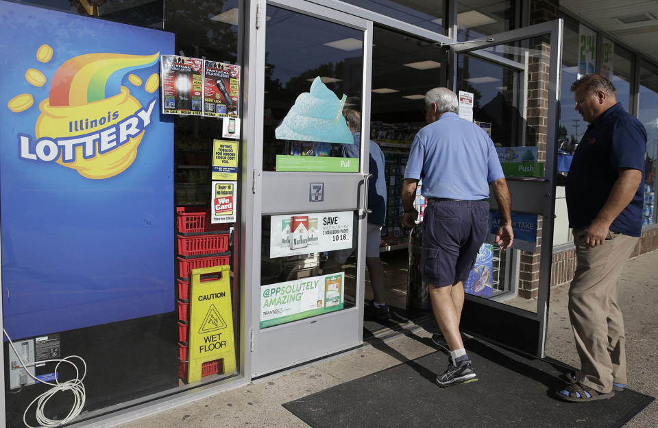 <p>Customers walk into a convenience store to buy Powerball lottery tickets in Northbrook, Ill., Aug. 23, 2017. Lottery officials said the grand prize for Wednesday night’s drawing has reached $700 million, he second -largest on record for any U.S. lottery game. (Photo: Nam Y. Huh/AP) </p>