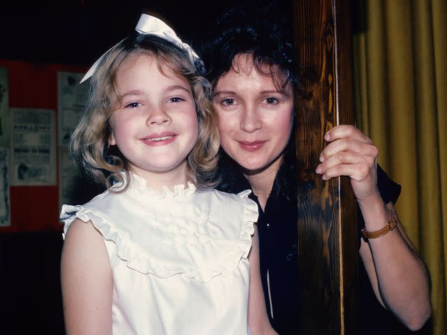 <p>Yvonne Hemsey/Getty</p> Drew Barrymore poses for a photograph June 8, 1982 with her mother Jaid Barrymore in New York City.