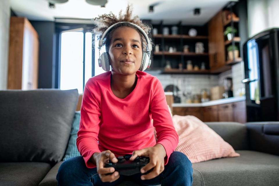 Your brain on video games is hopping. <a href="https://www.gettyimages.com/detail/photo/teenage-girl-playing-video-games-at-home-royalty-free-image/1297616478" rel="nofollow noopener" target="_blank" data-ylk="slk:Riska/E+ via Getty Images;elm:context_link;itc:0;sec:content-canvas" class="link ">Riska/E+ via Getty Images</a>