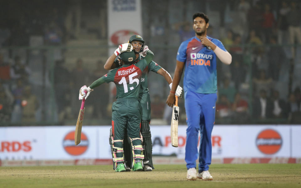 Bangladesh cricket team captain Mahmudullah, behind center, celebrates with Mushfiqur Rahim after wining first T20 cricket match against India at the Arun Jaitley stadium, in New Delhi, India, Sunday, Nov. 3, 2019. (AP Photo/Manish Swarup)