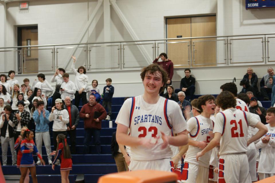 New Hartford senior star Zach Philipkoski is all smiles after the Spartans defeat Troy 69-60 in the Class A Subregionals at Liverpool High School
