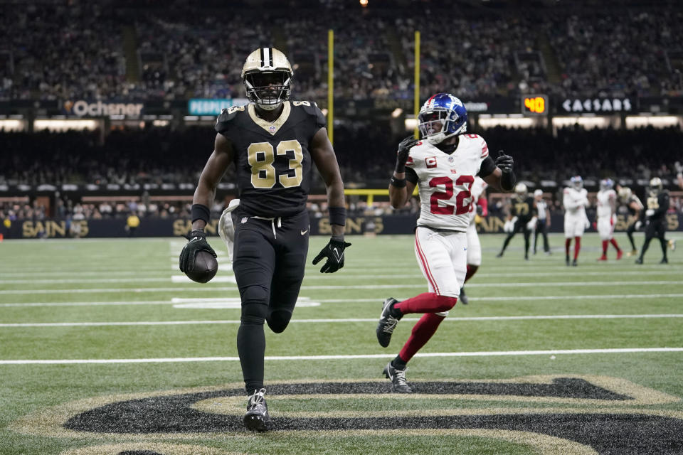 New Orleans Saints tight end Juwan Johnson (83) steps into the end zone past New York Giants cornerback Adoree' Jackson (22) on a 23-yard touchdown reception during the second half of an NFL football game Sunday, Dec. 17, 2023, in New Orleans. (AP Photo/Gerald Herbert)