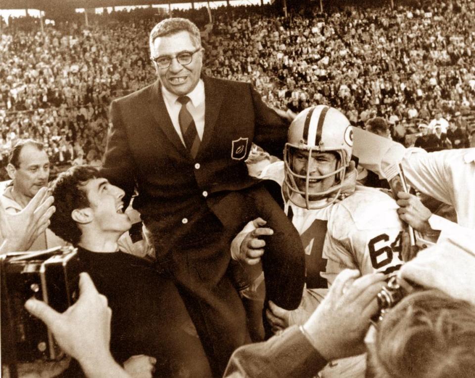 Green Bay Packers coach Vince Lombardi is carried off the field after his team defeated the Oakland Raiders 33 to 14 in the Super Bowl II game in Miami, Fl. on Jan. 14, 1968. Packers guard Jerry Kramer (64) is at right.