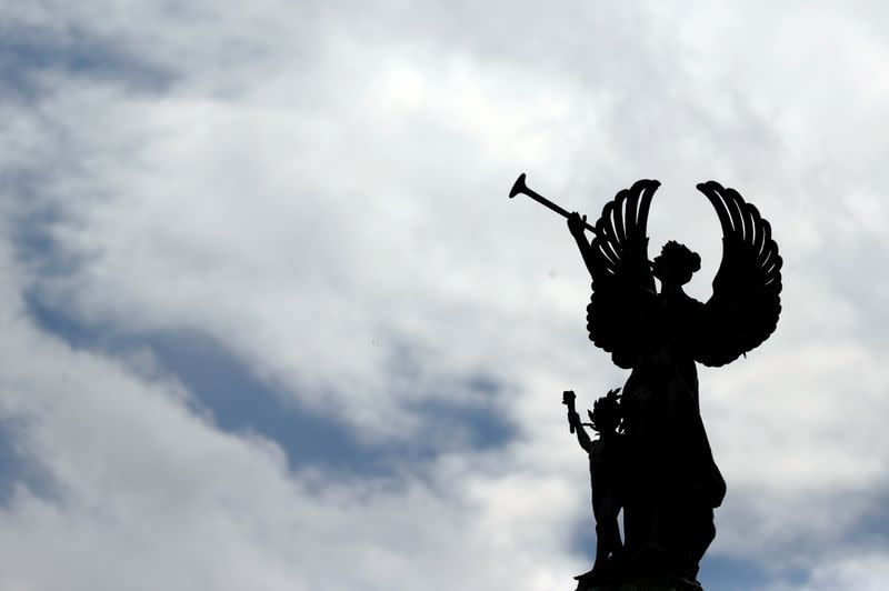 FILE PHOTO: The silhouette of an effigy is seen outside the Argentine National Congress as senators debate inside during an extraordinary session on the debate of a bill on renegotiation of the public external debt, in Buenos Aires