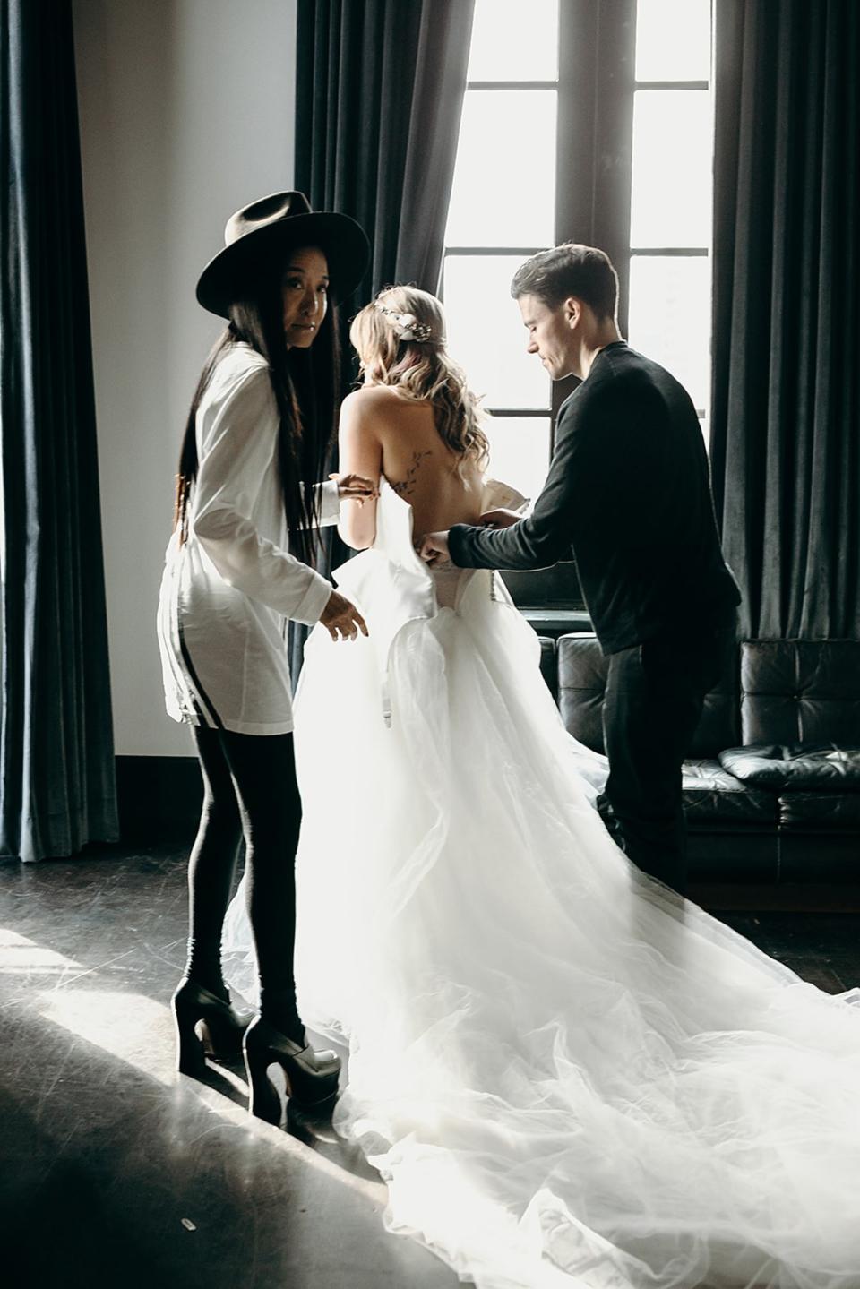 “Mia is a free spirit, artistic, passionate, a musician in her own right!” says designer Vera Wang. “I envisioned this dress with a bodice of vintage detail and exposed garters dripping over a bed of distressed tulle! I cannot think of a more seductive, playful, or charming look for such a unique bride.”