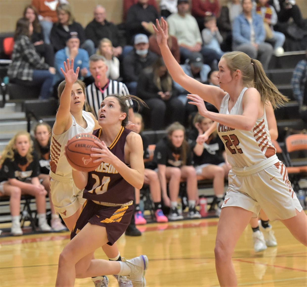 Windsor High School girls basketball player Mykaela Moore puts up shot during a 58-46 win at Mead on Friday, Jan. 28, 2022, in Longmont, Colo.