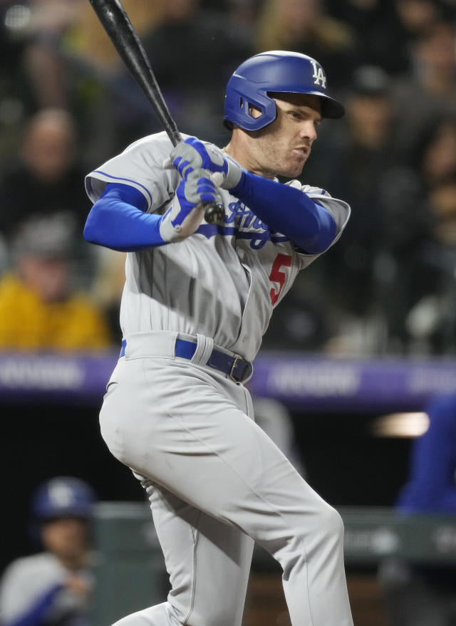 Martinez helps power Dodgers past Rockies 14-3 after a severe weather delay