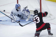 Ottawa Senators right wing Evgenii Dadonov gets the puck past Toronto Maple Leafs goaltender Jack Campbell during the third period of an NHL hockey game in Ottawa, Ontario, Saturday, Jan. 16, 2021. (Adrian Wyld/The Canadian Press via AP)