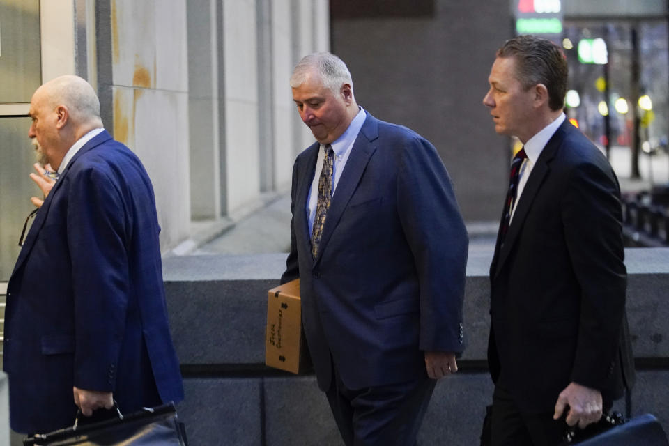 FILE - Former Ohio House Speaker Larry Householder, center, walks into Potter Stewart U.S. Courthouse with his attorneys, Mark Marein, left, and Steven Bradley, right, before jury selection in his federal trial, Jan. 20, 2023, in Cincinnati, Ohio. The federal government rested its case Monday, Feb. 27, in lobbyist Matt Borges and Householder's racketeering trial, after presenting jurors with reams of financial documents, emails, texts, wire-tap audio and firsthand accounts of what prosecutors allege was a $60 million bribery scheme to pass a $1 billion ratepayer-funded nuclear bailout. (AP Photo/Joshua A. Bickel, File)