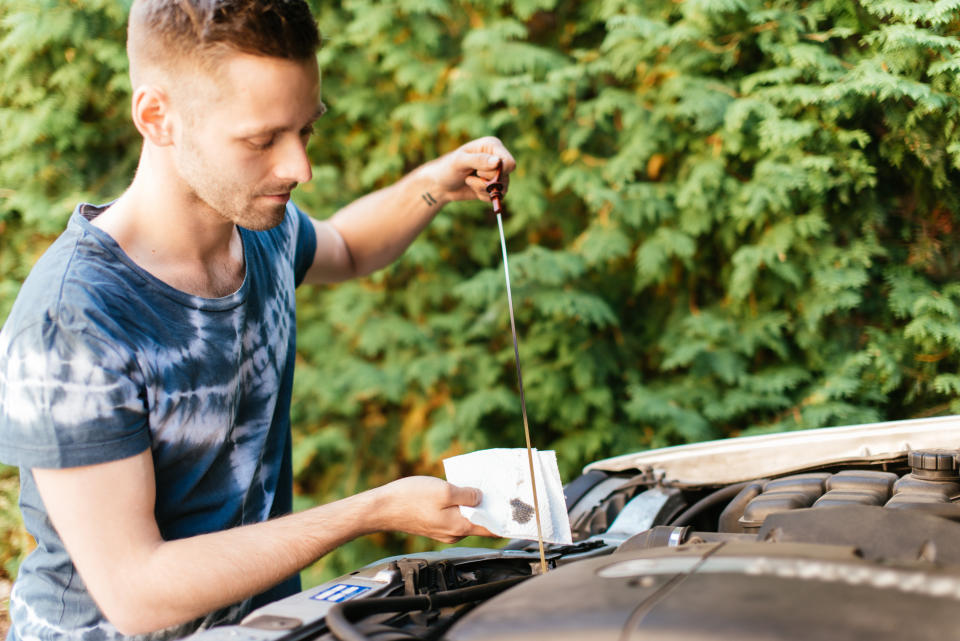 It's not a bad idea to check your car's oil status before heading out. (Photo: Guido Mieth via Getty Images)