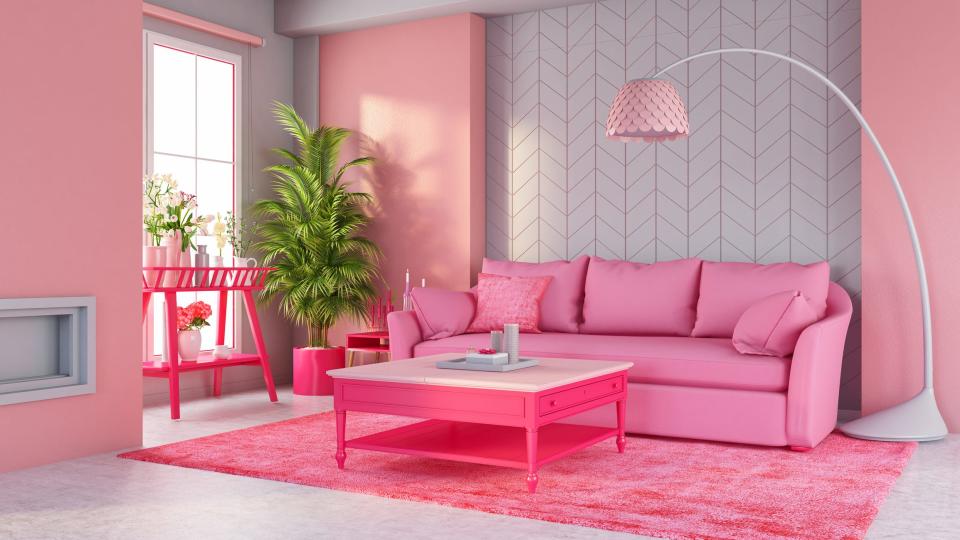 Pink couch in living room with pink table