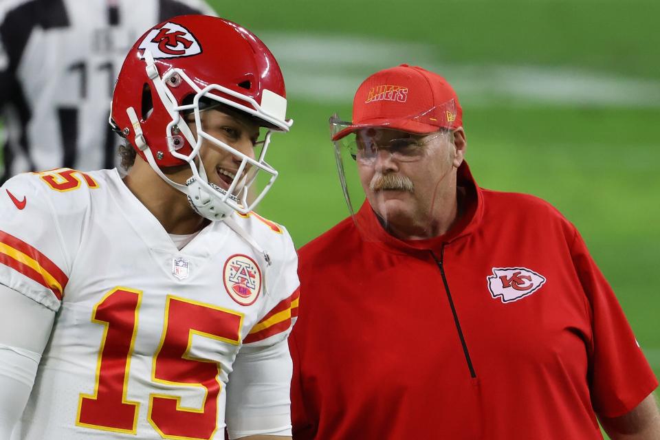 Quarterback Patrick Mahomes #15 of the Kansas City Chiefs talks with head coach Andy Reid before the NFL game against the Las Vegas Raiders at Allegiant Stadium on November 22, 2020 in Las Vegas, Nevada. The Chiefs defeated the Raiders 35-31.