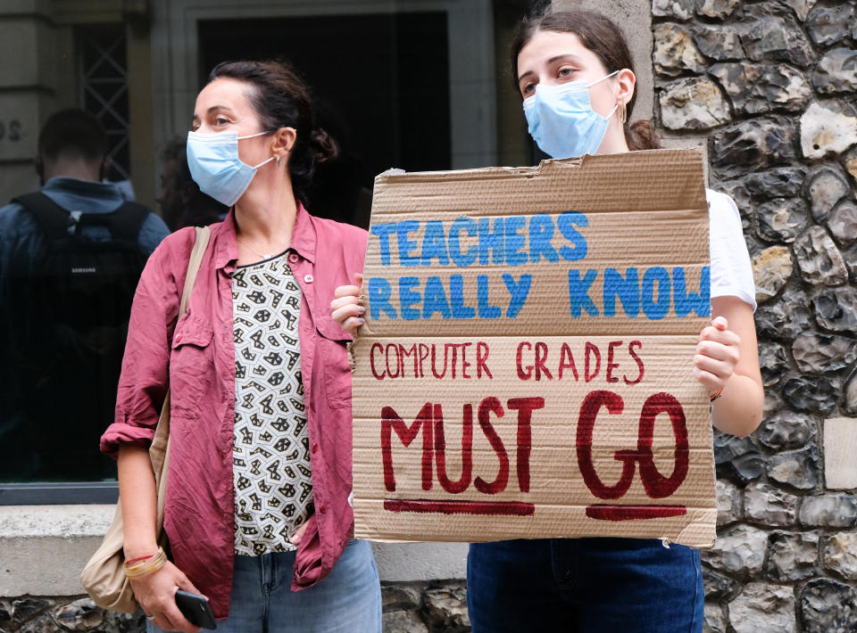 LONDON, UNITED KINGDOM - AUGUST 14, 2020: Protest outside the Department for Education after students affected by the mass downgrading of A-level results in England  - PHOTOGRAPH BY Matthew Chattle / Barcroft Studios / Future Publishing (Photo credit should read Matthew Chattle/Barcroft Media via Getty Images)