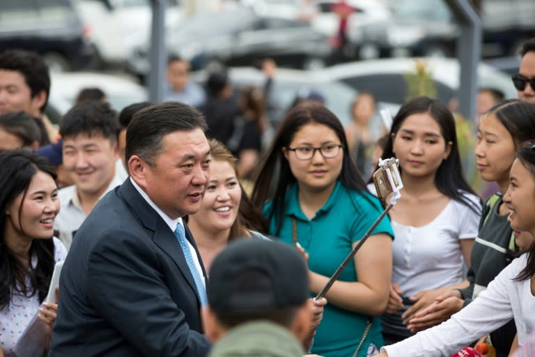 Mieygombo Enkhbold (L), pictured on June 10, 2017, is popular among older voters, but accusations against him of corruption have helped create what experts call a negative election tone