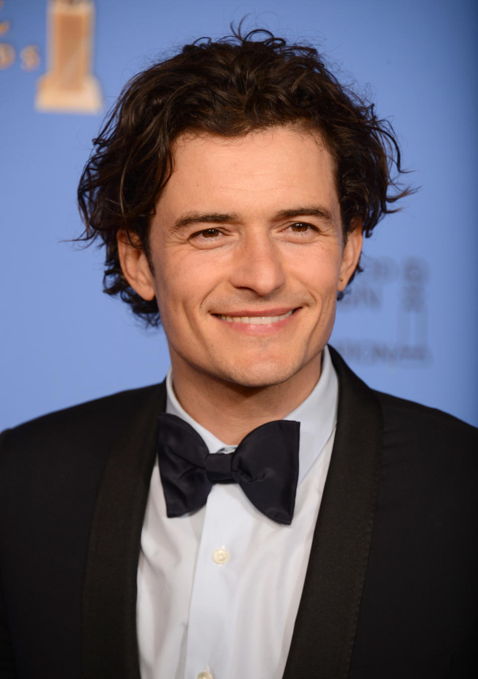 Orlando Bloom poses in the press room at the 71st annual Golden Globe Awards at the Beverly Hilton Hotel on Sunday, Jan. 12, 2014, in Beverly Hills, Calif. (Photo by Jordan Strauss/Invision/AP)