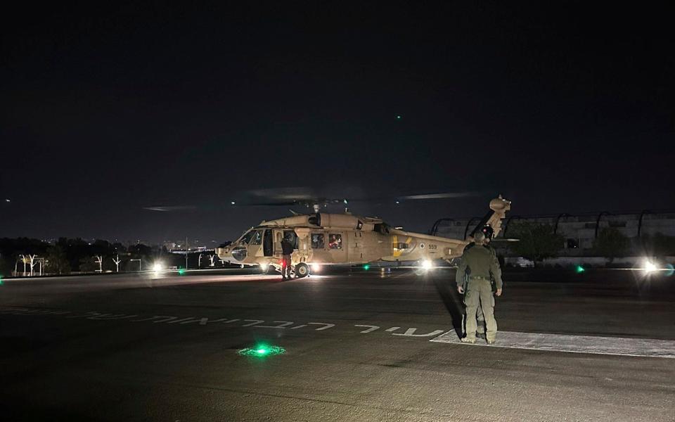 An Israeli Air Force helicopter carrying two released hostages arrives at Sheba Medical Centre in Ramat Gan, Israel