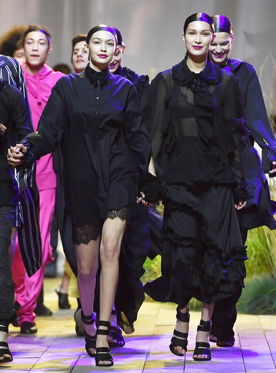 <p>The sisters stormed the runway hand-in-hand at H&M, coordinating in chic all-black ensembles while Bella's ex, The Weeknd, <a rel="nofollow noopener" href="http://www.instyle.com/news/bella-hadid-the-weeknd-reunite-paris-fashion-week" target="_blank" data-ylk="slk:performed;elm:context_link;itc:0;sec:content-canvas" class="link ">performed</a> on stage. Hey, happiness <em>is </em>the best revenge.</p>