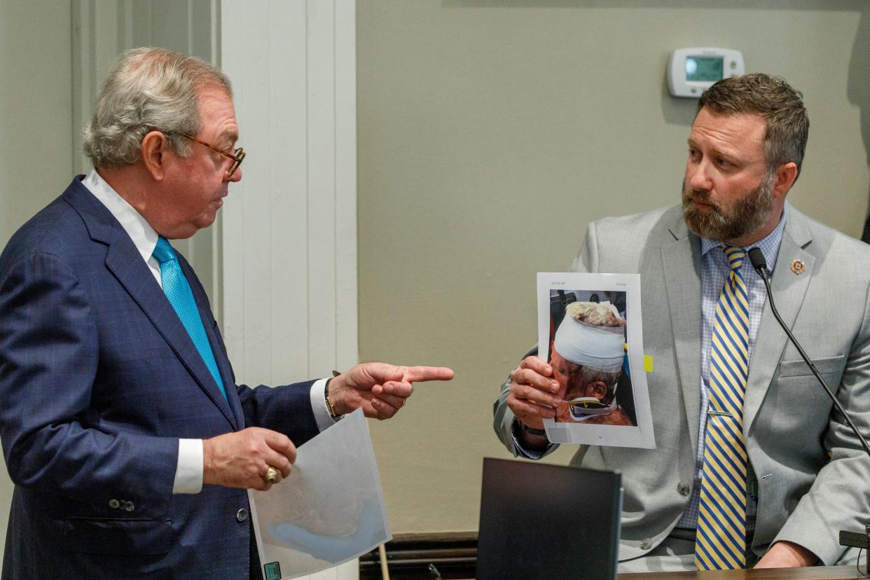 Defence attorney Dick Harpootlian, left, sparred with South Carolina Law Enforcement Division special agent Ryan Kelly in cross-examination on Friday (AP)