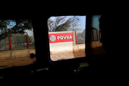 The logo of the Venezuelan state oil company PDVSA is seen on one of their offices in Punto Fijo, Venezuela July 22, 2016. Picture taken July 22, 2016. To match Special Report VENEZUELA-PDVSA/CONTRACT REUTERS/Carlos Jasso