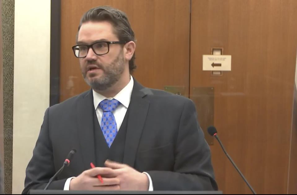 In this image from video, defense attorney Eric Nelson questions Dr. David Fowler as Hennepin County Judge Peter Cahill presides, Wednesday, April 14, 2021, in the trial of former Minneapolis police Officer Derek Chauvin at the Hennepin County Courthouse in Minneapolis, Minn. Chauvin is charged in the May 25, 2020 death of George Floyd. (Court TV via AP, Pool)