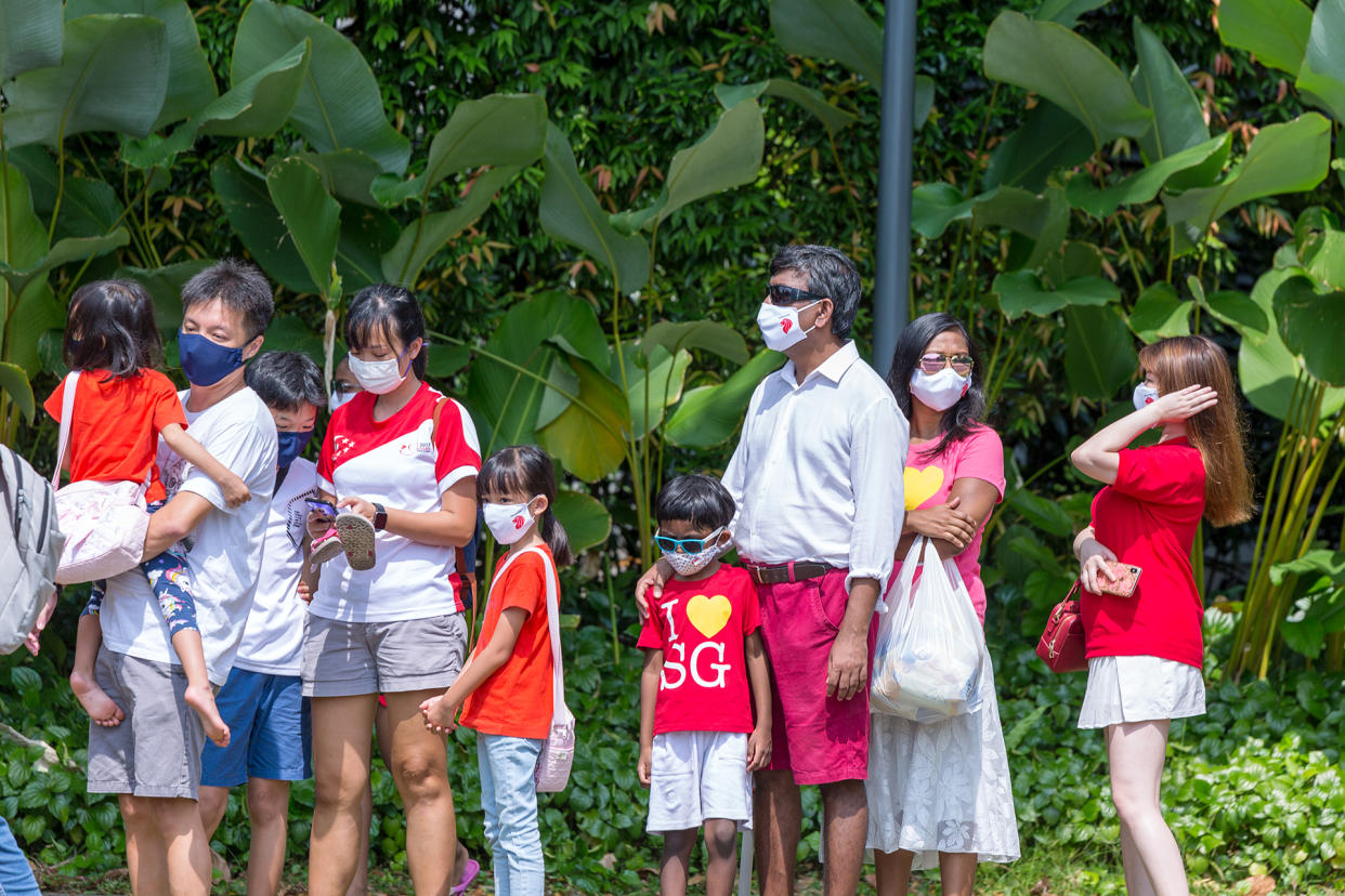 People waiting outside the Ng Teng Fong General Hospital on Sunday (9 August) morning to catch the National Day Parade 2020 mobile column passing by. (PHOTO: Dhany Osman / Yahoo News Singapore)