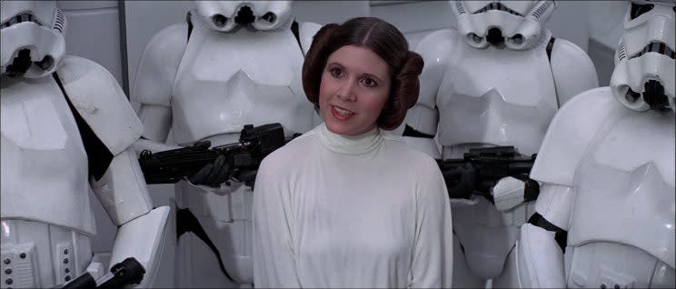 Carrie Fisher as Princess Leia wearing her iconic buns. (Photo credit: LucasFilm)