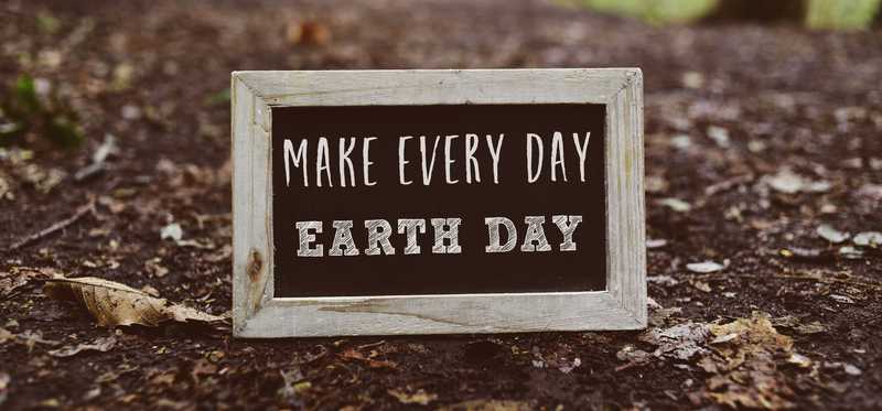 Make every day earth day sign outside in the dirt.