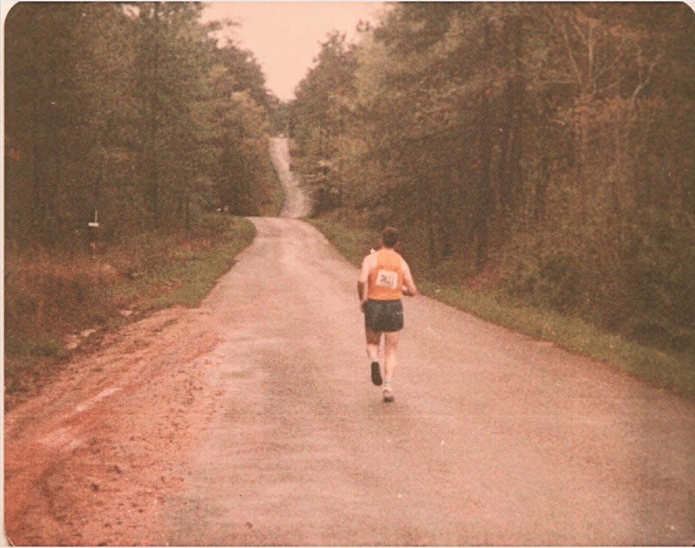 Mike Tupa running a road in Macon, Ga., as part of the Marine Corps running team in 1982 from the Beaufort MCAS.