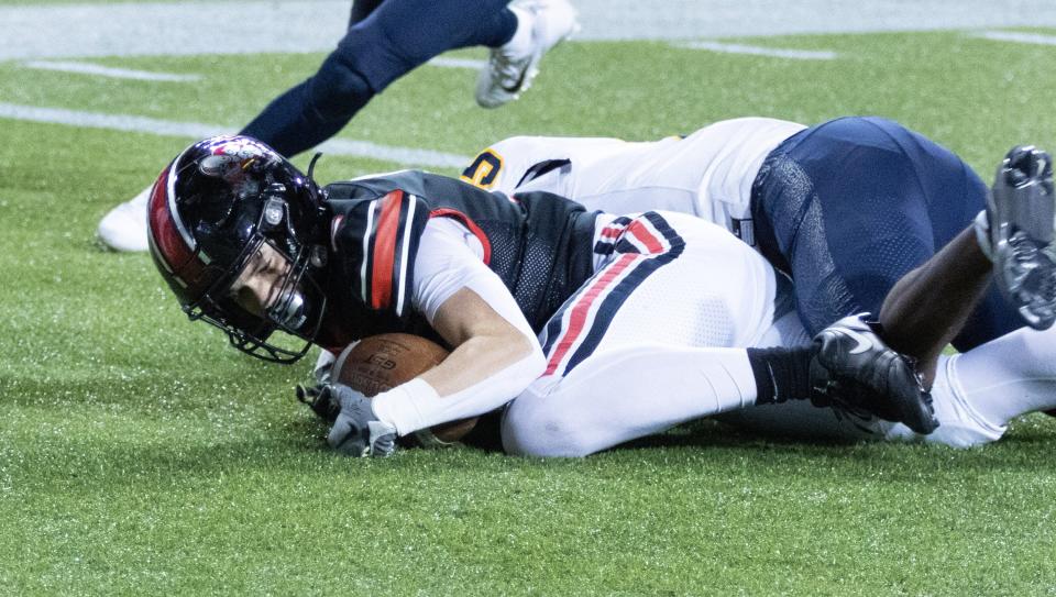 McKinley’s Alex Vazquez ((2) recovers the ball in the end zone for a touchdown giving McKinley a 28-24 lead with 53 seconds to go in the game following a successful point-after kick, Friday, Nov. 3, 2023.