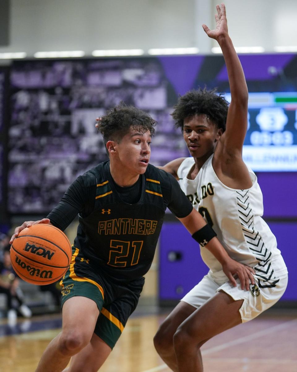 Peoria's Andrew Camacho (21), at left, dribbles towards the basket while guarded by Verrado's Sam Chabala (30), at right, during a Thanksgiving boys basketball tournament at Millennium High School on Wednesday, Nov. 23, 2022, in Goodyear. The game finished 81-34 to Peoria.
