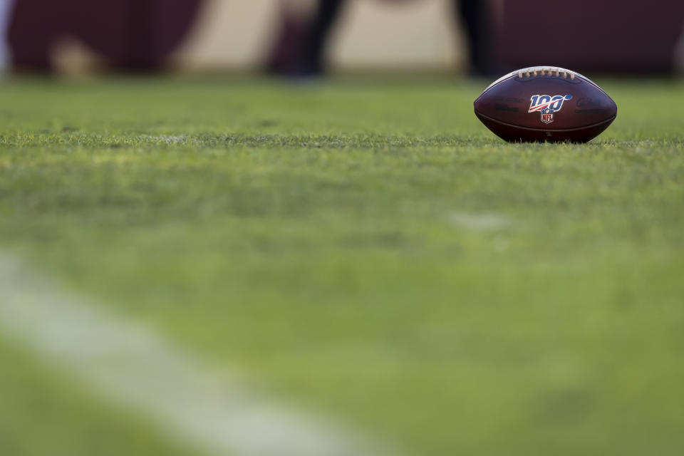 LANDOVER, MD - DECEMBER 15: A Wilson brand NFL football with 100 logo is seen on the field during the first half of the game between the Washington Redskins and the Philadelphia Eagles at FedExField on December 15, 2019 in Landover, Maryland. (Photo by Scott Taetsch/Getty Images)