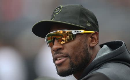 FILE PHOTO: Apr 25, 2019; Pittsburgh, PA, USA; Pittsburgh Pirates teammates are reflected in the glasses of Pittsburgh Pirates outfielder Starling Marte (6) during the seventh inning at PNC Park. Arizona won 5-0. Mandatory Credit: Charles LeClaire-USA TODAY Sports/File Photo