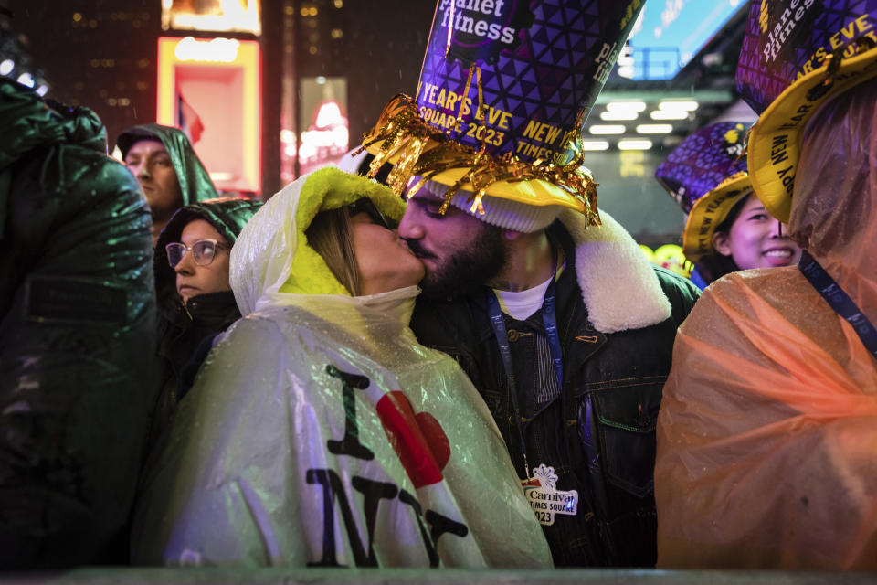 A couple kisses in Times Square as they attend the New Year's Eve celebrations on Saturday, Dec. 31, 2022, in New York. (AP Photo/Stefan Jeremiah)