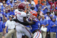 Florida safety Trey Dean III, right, is called for pass interference as he hits Alabama wide receiver Jameson Williams (1) during the first half of an NCAA college football game, Saturday, Sept. 18, 2021, in Gainesville, Fla. (AP Photo/John Raoux)