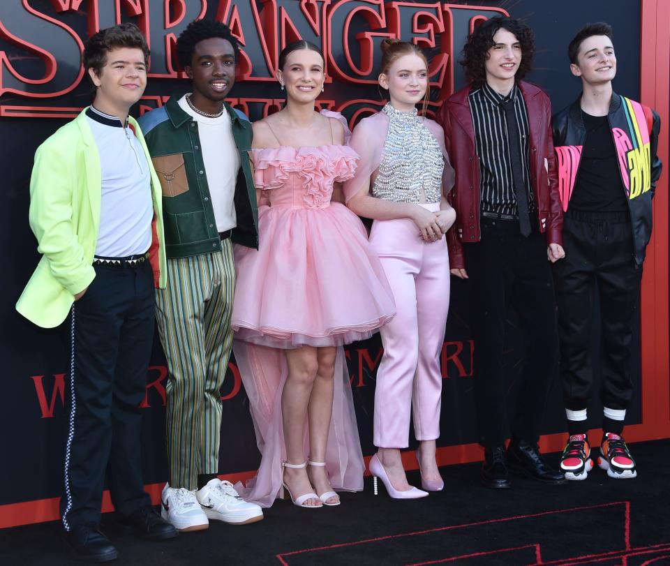 (L-R) Actor Gaten Matarazzo, Caleb McLaughlin, Millie Bobbie Brown, Sadie Sink, Finn Wolfhard and Noah Schnapp attend Netflix's "Stranger Things 3" premiere at Santa Monica high school Barnum Hall on June 28, 2019 in Santa Monica, California. (Photo by Chris Delmas / AFP)        (Photo credit should read CHRIS DELMAS/AFP/Getty Images)