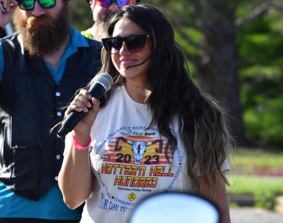 Cory Meharey, the daughter of late Charles and Lisa McBride, speaks during the Ride to Remember event on May 29, 2024, in Wichita Falls.