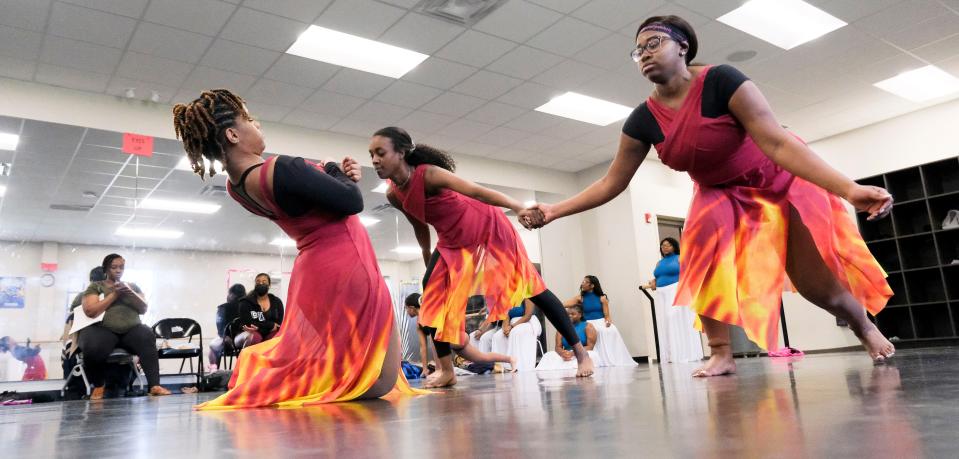 Students in the Tuscaloosa Fine Arts Academy at Paul Bryant High School rehearse Monday for their roles in the Tuscaloosa Symphony Orchestra's annual young people's concert "Give Me Space." A trio of dancer rehearse a routine that will be used in the Sunday concert.