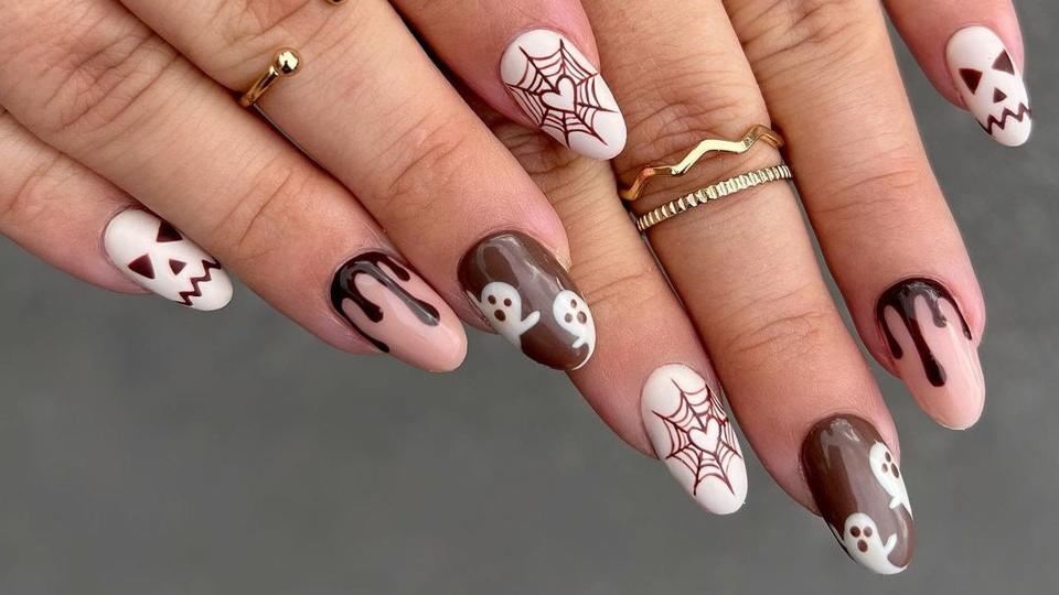 Brown Halloween nails with webs and ghosts 