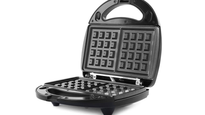 Waffle iron on white background