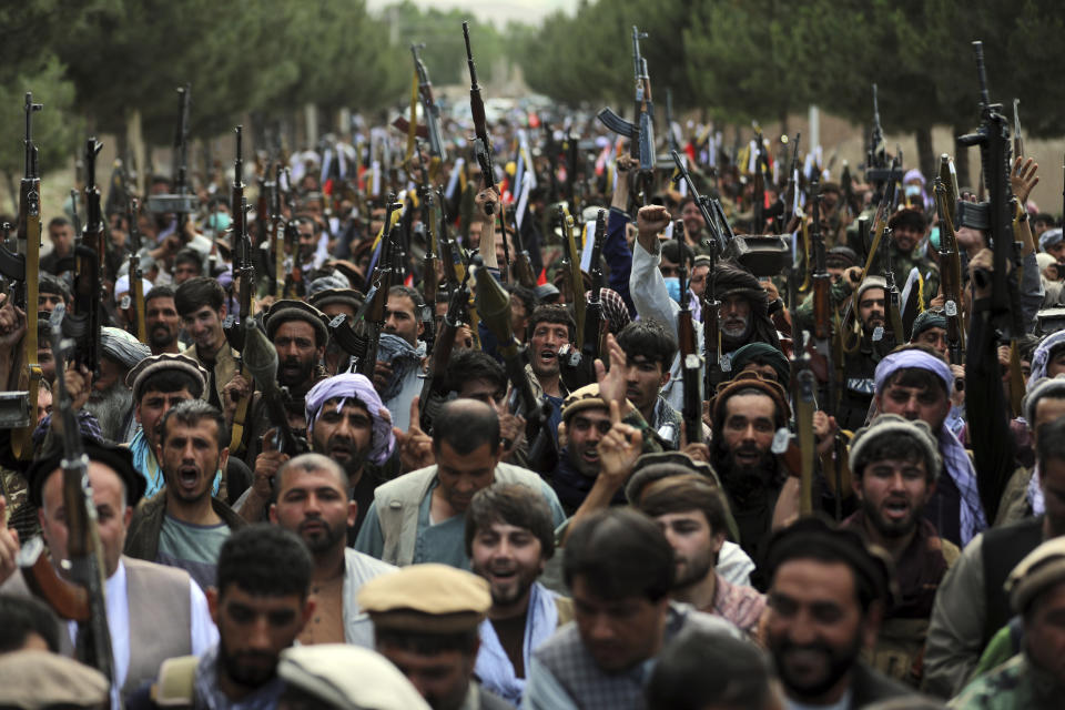 FILE - In this June 23, 2021 file photo, Afghan militiamen join Afghan defense and security forces during a gathering in Kabul, Afghanistan. The US and NATO have promised to pay $4 billion a year until 2024 to finance Afghanistan’s military and security forces, which are struggling to contain an advancing Taliban. Already since 2001, the U.S. has spent nearly $89 billion to build, equip and train the forces. (AP Photo/Rahmat Gul, File)