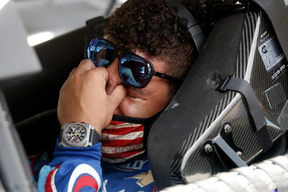 FILE - Driver Bubba Wallace sits in his car prior to the start of the NASCAR Cup Series at the Talladega Superspeedway in Talladega, Ala., Monday, June 22, 2020. On June 21, 2020, NASCAR alerted Wallace a noose had been found in his garage stall at Talladega Superspeedway in Alabama. “RACE: Bubba Wallace," is a Netflix docuseries that chronicles the only Black driver at NASCAR's top level and his professional rise and personal role in social justice issues. (AP Photo/John Bazemore, File)
