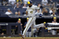 Milwaukee Brewers' Carlos Santana scores a run during the eighth inning of a baseball game against the New York Yankees, Saturday, Sept. 9, 2023, in New York. (AP Photo/Adam Hunger)