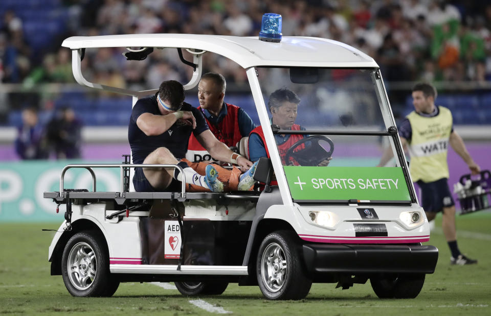 Scotland's Hamish Watson reacts as he is taken from the field injured during the Rugby World Cup Pool A game at International Stadium between Ireland and Scotland in Yokohama, Japan, Sunday, Sept. 22, 2019. (AP Photo/Jae Hong)