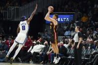 Atlanta Hawks guard Bogdan Bogdanovic (13) takes a shot against Sacramento Kings forward Maurice Harkless (8) in the second half of an NBA basketball game Wednesday, Jan. 26, 2022, in Atlanta. (AP Photo/John Bazemore)