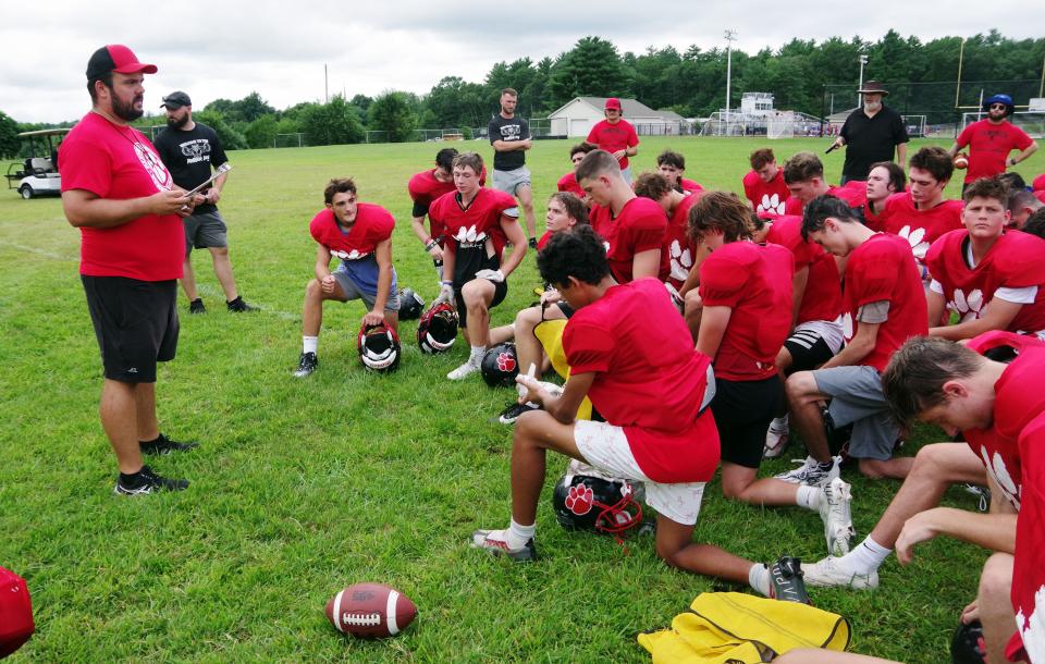 Whitman-Hanson head coach Zack Botelho addresses his team after practice Tuesday, Aug. 29, 2023.