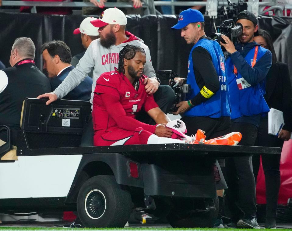 December 12, 2022; Glendale, Ariz; USA; Cardinals quarterback Kyler Murray (1) goes down injured during the first half of a game against the Patriots at State Farm Stadium. 