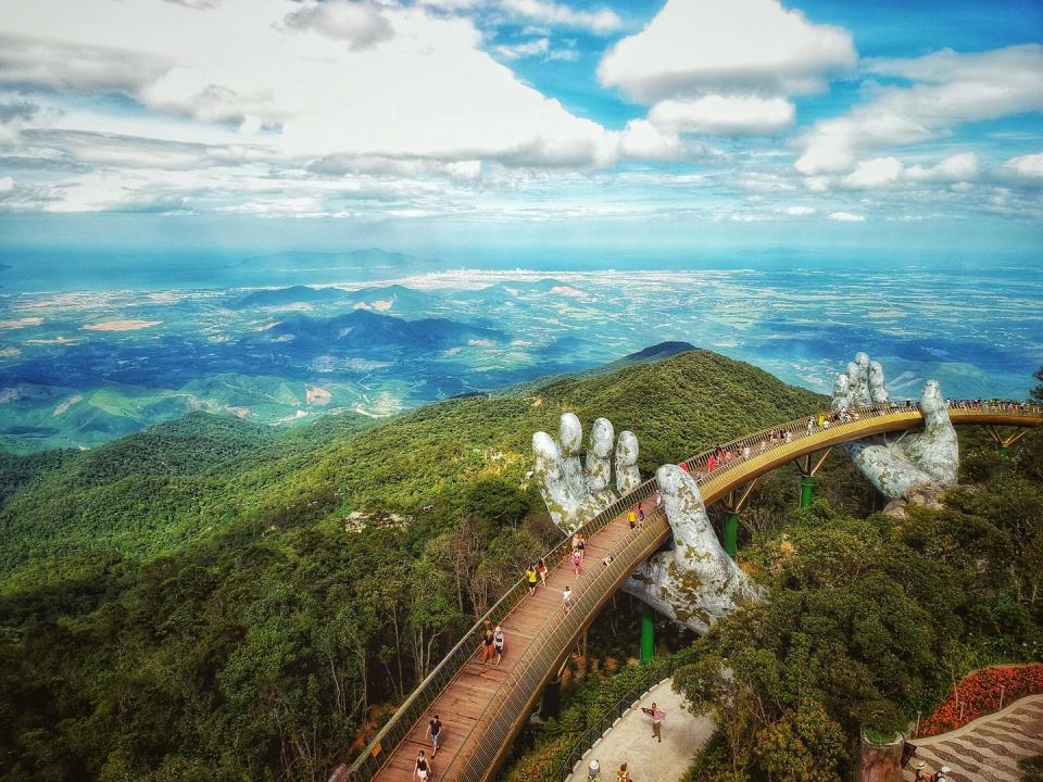 high angle shot of a golden bridge, ba na hills, da nang, vietnam