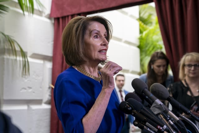 Nancy Pelosi responds to reporters as she departs after meeting with House Democrats