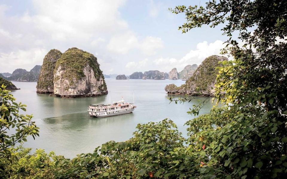 A traditional Chinese-style junk cruises through Ha Long Bay, in northeastern Vietnam.